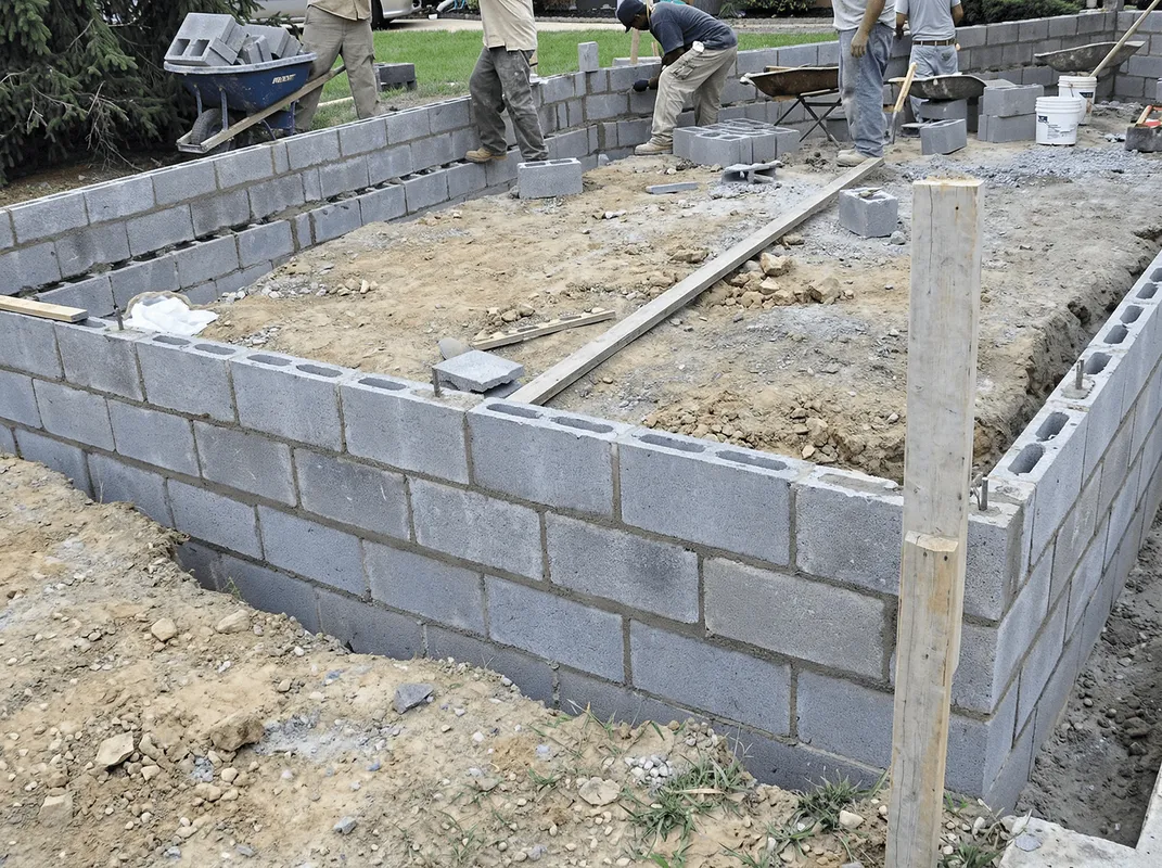 Professionals building a foundation with blocks in Spokane, WA