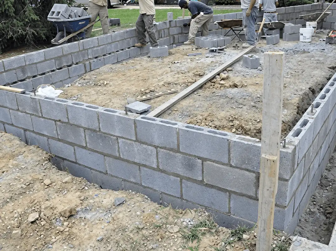 Professionals building a foundation with blocks in Spokane, WA