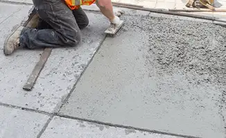 Professional repairing a concrete floor in Spokane, WA