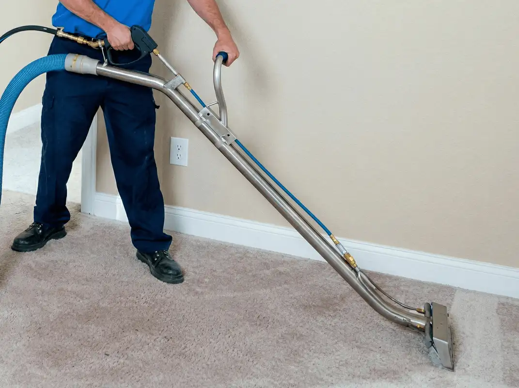 Professional operating a liquid removal machine on a carpeted floor in Spokane, WA